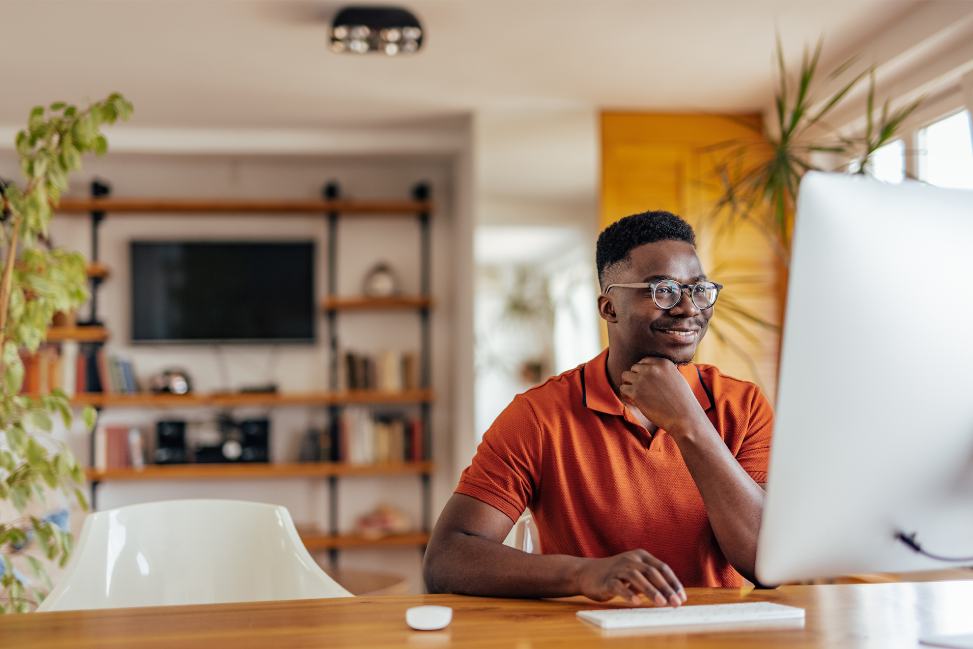 Man using computer. Reading articles about fraud.
