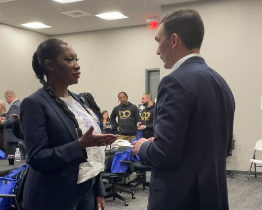 Man and woman at the "Impact through Empathy" event